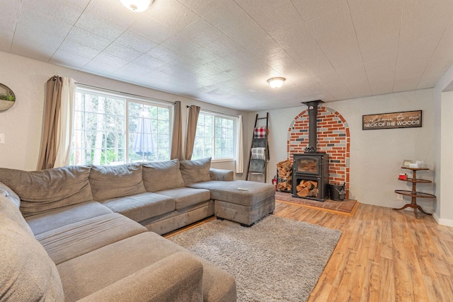 8431 Fertile Valley Rd, Newport, WA 99156 - living area with light wood finished floors, healthy amount of natural light, and a wood stove