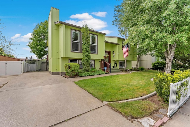 4022 E 25th Ave, Spokane, WA 99223 - raised ranch featuring a gate, driveway, and a chimney