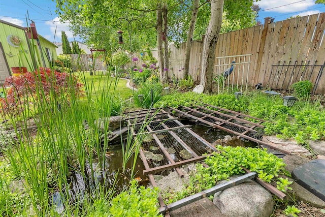 4022 E 25th Ave, Spokane, WA 99223 - fenced backyard featuring a vegetable garden