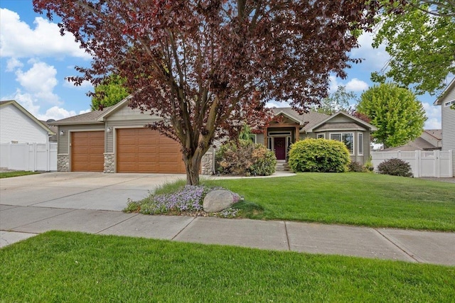 12914 E 36th Ave, Spokane Valley, WA 99206 - view of front of property featuring an attached garage, concrete driveway, and stone siding