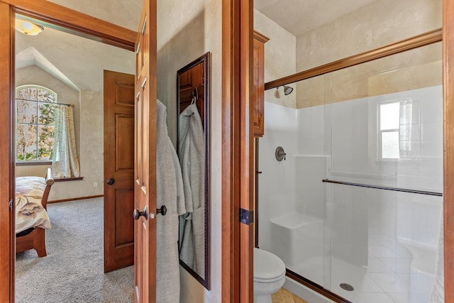 1467 E Lacey Ave, Hayden, ID 83835 - bathroom with a shower stall, toilet, vaulted ceiling, baseboards, and ensuite bath