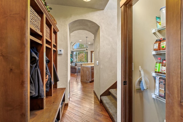 1467 E Lacey Ave, Hayden, ID 83835 - mudroom featuring arched walkways, hardwood / wood-style floors, and a textured wall