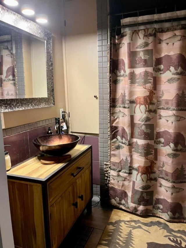 1654 Southshore Diamond Lake Rd, Newport, WA 99156 - full bath with vanity, tile walls, and a shower with curtain