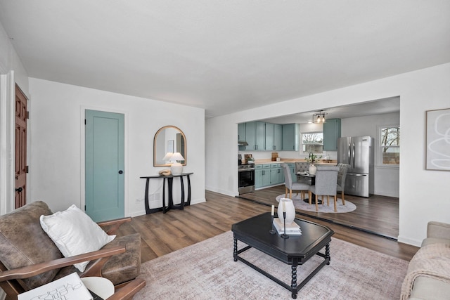 614 S Lawson St, Airway Heights, WA 99001 - living area featuring dark wood-type flooring and baseboards