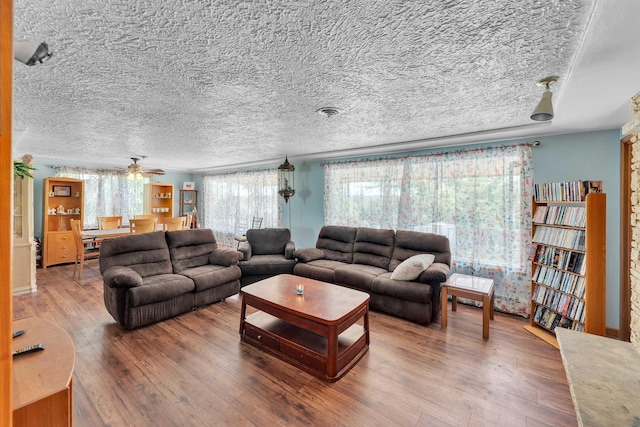 4004 W Taft Dr, Spokane, WA 99208 - living area featuring a textured ceiling, hardwood / wood-style floors, and a ceiling fan