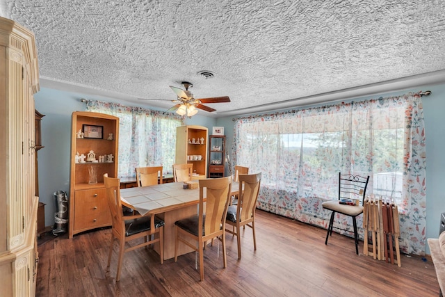 4004 W Taft Dr, Spokane, WA 99208 - dining space with a textured ceiling, wood finished floors, and a ceiling fan