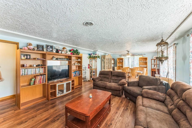 4004 W Taft Dr, Spokane, WA 99208 - living area featuring a textured ceiling, wood finished floors, and a ceiling fan