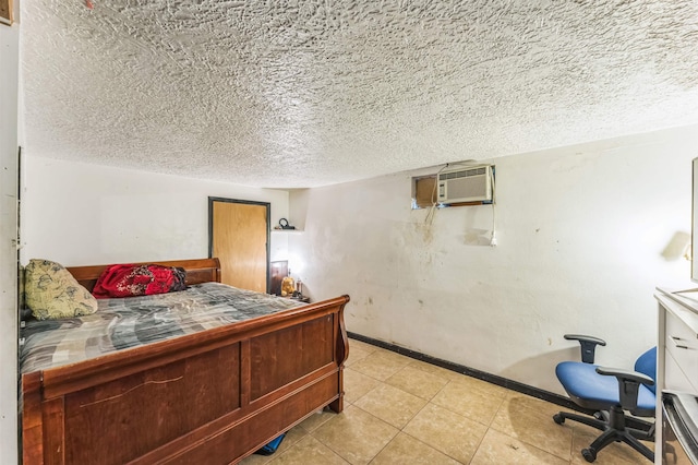 4004 W Taft Dr, Spokane, WA 99208 - bedroom featuring a wall mounted AC, a textured ceiling, light tile patterned floors, and baseboards