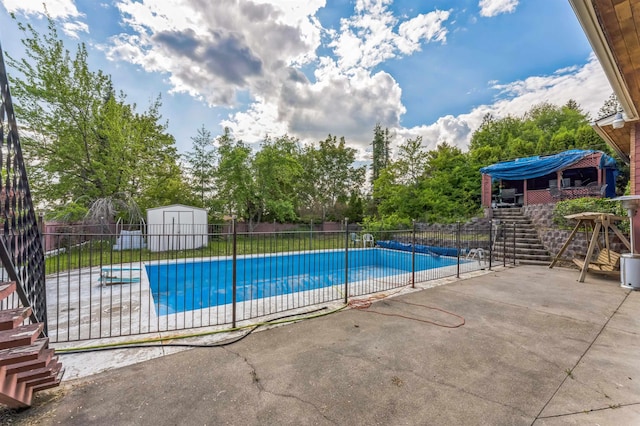 4004 W Taft Dr, Spokane, WA 99208 - view of swimming pool featuring a patio, stairs, and view of wooded area
