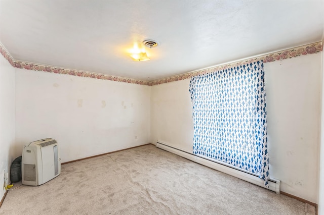 4004 W Taft Dr, Spokane, WA 99208 - carpeted empty room with a baseboard heating unit and baseboards