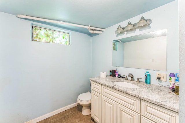 4004 W Taft Dr, Spokane, WA 99208 - half bath with vanity, toilet, tile patterned floors, and baseboards