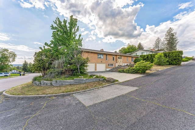 4004 W Taft Dr, Spokane, WA 99208 - view of front of house featuring a garage and driveway