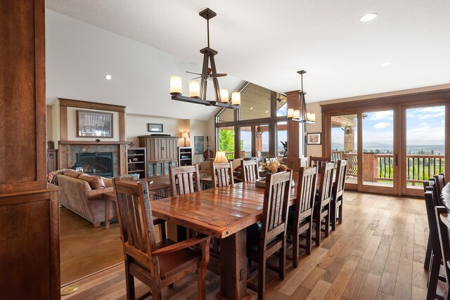 16510 N Brannon Ln, Spokane, WA 99208 - dining area with a glass covered fireplace, a chandelier, light wood finished floors, and recessed lighting