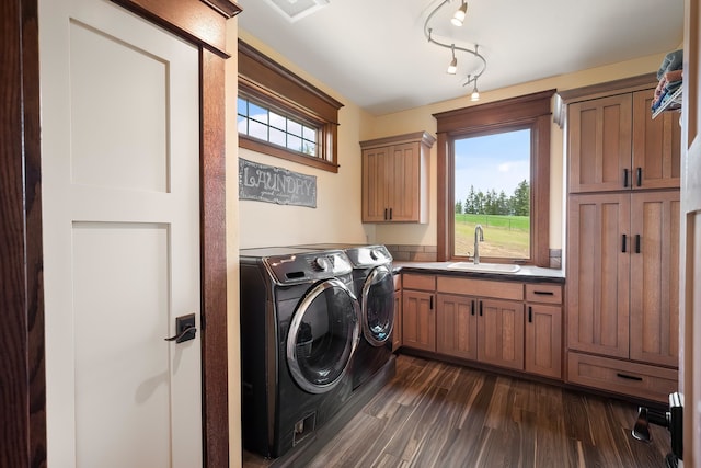 16510 N Brannon Ln, Spokane, WA 99208 - washroom with cabinet space, separate washer and dryer, plenty of natural light, and dark wood-style flooring