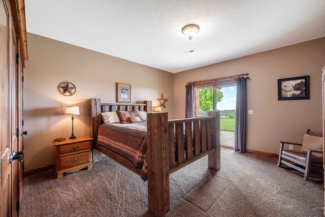 16510 N Brannon Ln, Spokane, WA 99208 - carpeted bedroom featuring access to exterior and baseboards