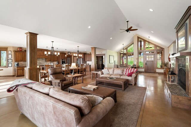 16510 N Brannon Ln, Spokane, WA 99208 - living area featuring high vaulted ceiling, a fireplace with raised hearth, ceiling fan, recessed lighting, and concrete floors