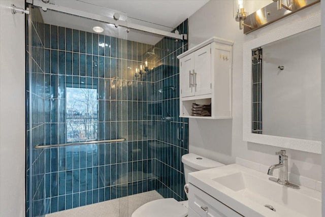 700 W 7th Ave # 206, Spokane, WA 99204 - bathroom featuring toilet, a shower stall, and vanity