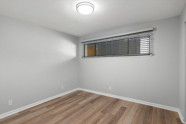 700 W 7th Ave # 206, Spokane, WA 99204 - spare room featuring wood finished floors and baseboards