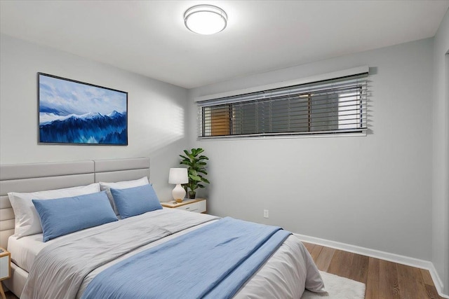 700 W 7th Ave # 206, Spokane, WA 99204 - bedroom with wood finished floors and baseboards