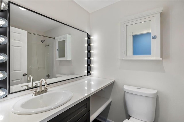 700 W 7th Ave # 206, Spokane, WA 99204 - full bathroom featuring toilet, vanity, and a shower