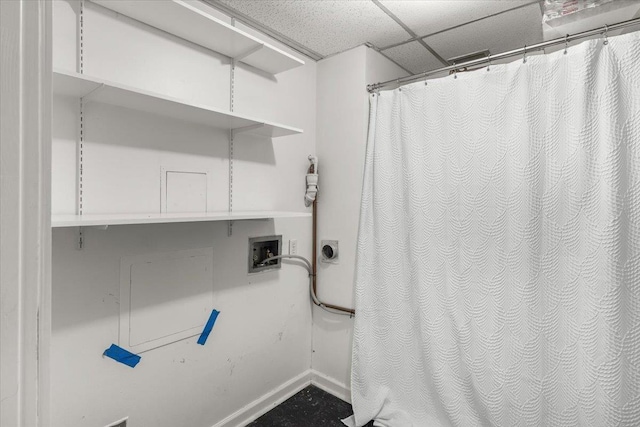 700 W 7th Ave # 206, Spokane, WA 99204 - full bathroom featuring baseboards, a drop ceiling, and a shower with shower curtain