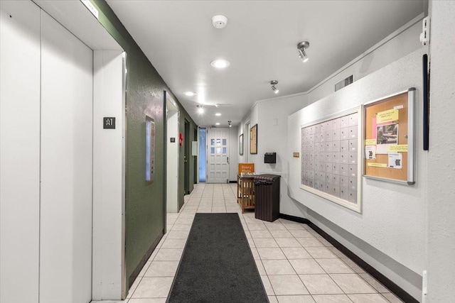 700 W 7th Ave # 206, Spokane, WA 99204 - corridor featuring mail area, elevator, light tile patterned floors, a textured wall, and recessed lighting