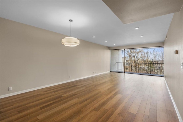 700 W 7th Ave # 206, Spokane, WA 99204 - empty room featuring baseboards, wood finished floors, and recessed lighting