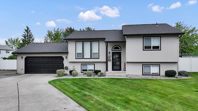 18920 E Augusta Ln, Spokane Valley, WA 99016 - split foyer home with an attached garage, concrete driveway, and roof with shingles