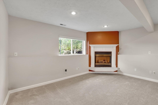 18920 E Augusta Ln, Spokane Valley, WA 99016 - unfurnished living room featuring carpet, baseboards, recessed lighting, and a textured ceiling