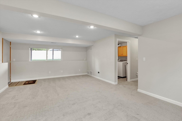 18920 E Augusta Ln, Spokane Valley, WA 99016 - basement featuring washer / clothes dryer, light colored carpet, recessed lighting, and baseboards