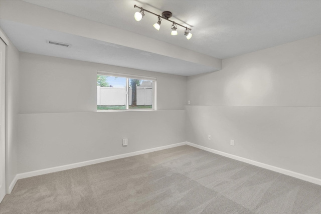 18920 E Augusta Ln, Spokane Valley, WA 99016 - unfurnished room with baseboards, carpet flooring, and track lighting