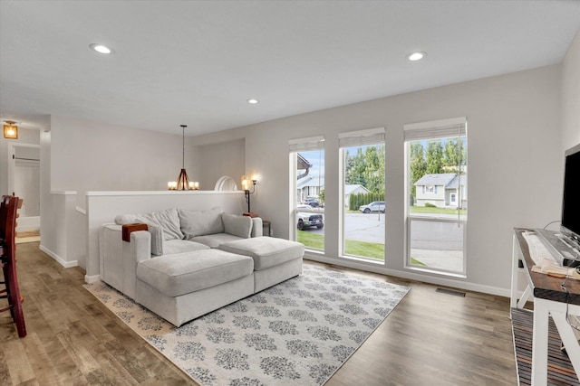 18920 E Augusta Ln, Spokane Valley, WA 99016 - living room with a chandelier, baseboards, wood finished floors, and recessed lighting
