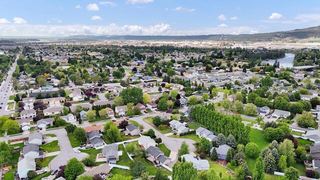 18920 E Augusta Ln, Spokane Valley, WA 99016 - aerial overview of property's location with nearby suburban area and a mountainous background