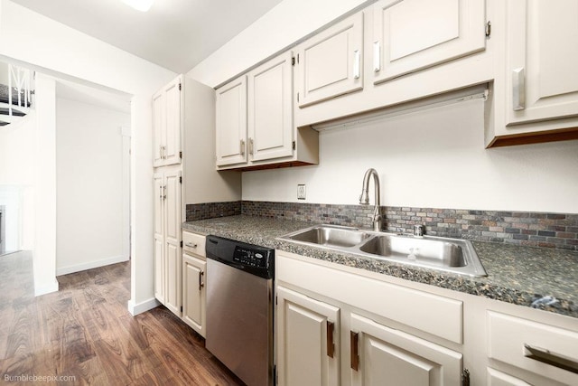 707 W 6th Ave Unit 41, Spokane, WA 99204 - kitchen with stainless steel dishwasher, a sink, dark wood-type flooring, dark countertops, and baseboards