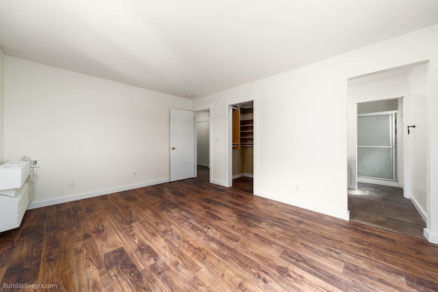 707 W 6th Ave Unit 41, Spokane, WA 99204 - unfurnished bedroom with wood finished floors, baseboards, and a closet