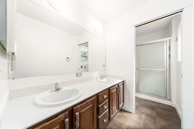 707 W 6th Ave Unit 41, Spokane, WA 99204 - full bath featuring double vanity, an enclosed shower, and baseboards