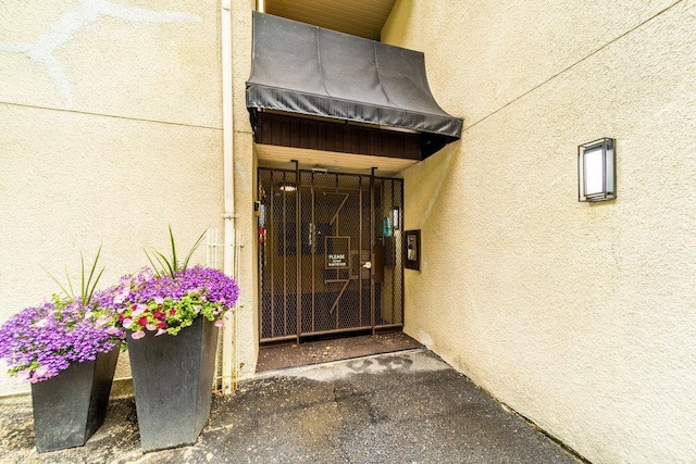 707 W 6th Ave Unit 41, Spokane, WA 99204 - entrance to property with stucco siding and a gate