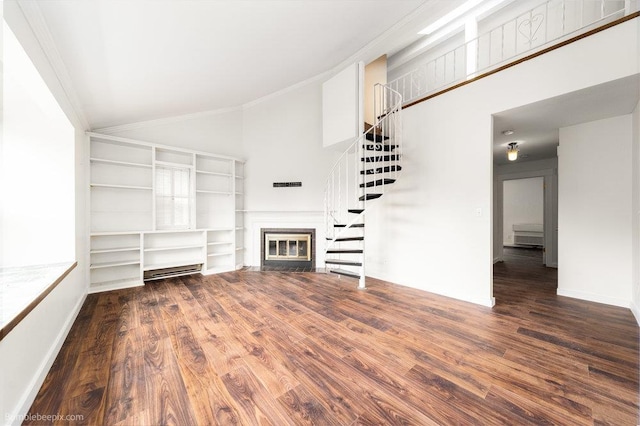 707 W 6th Ave Unit 41, Spokane, WA 99204 - unfurnished living room with high vaulted ceiling, stairs, a fireplace with flush hearth, wood finished floors, and ornamental molding