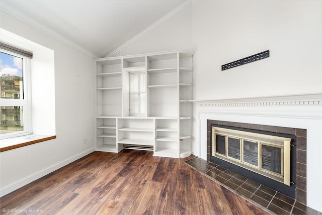 707 W 6th Ave Unit 41, Spokane, WA 99204 - unfurnished living room featuring lofted ceiling, a glass covered fireplace, built in features, wood finished floors, and baseboards