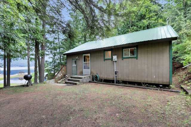 3970 Cedar Bay Rd, Loon Lake, WA 99148 - view of front of house featuring a water view and metal roof