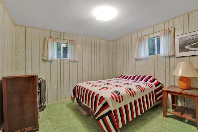 3970 Cedar Bay Rd, Loon Lake, WA 99148 - bedroom featuring carpet flooring, wood walls, and a textured ceiling