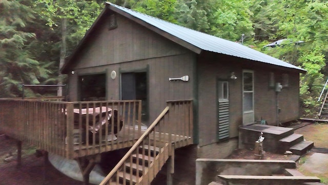 3970 Cedar Bay Rd, Loon Lake, WA 99148 - rear view of property featuring a wooden deck and metal roof