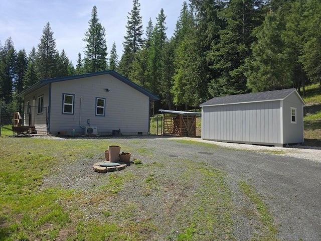 1108 Basin Rd, Colville, WA 99114 - view of side of home with a lawn and crawl space