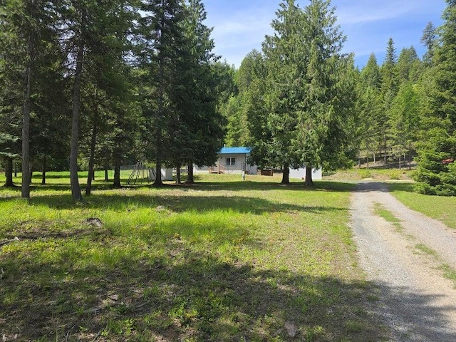 1108 Basin Rd, Colville, WA 99114 - view of dirt / gravel road featuring a wooded view