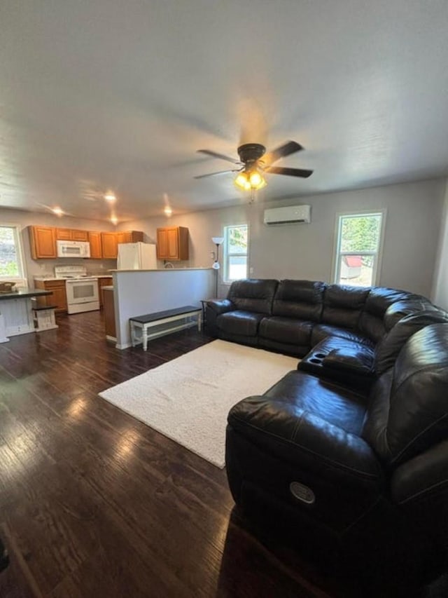 1108 Basin Rd, Colville, WA 99114 - living room with a wall mounted AC, healthy amount of natural light, and ceiling fan