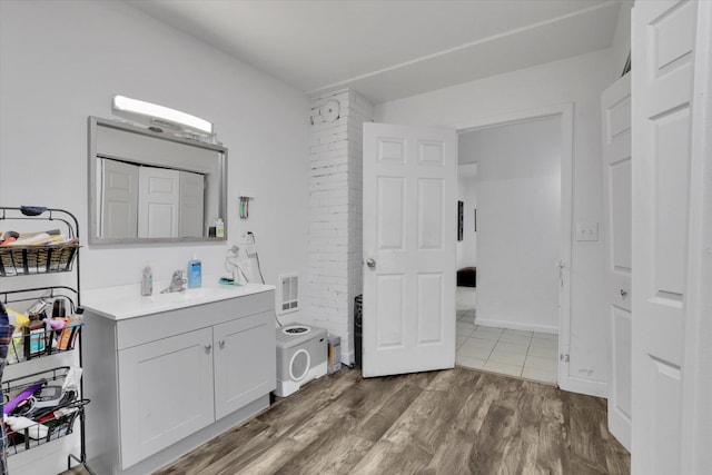 228 W Poplar St, Tekoa, WA 99033 - bathroom with vanity and wood finished floors