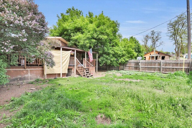 228 W Poplar St, Tekoa, WA 99033 - fenced backyard featuring stairway