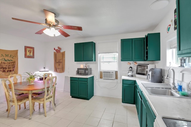 228 W Poplar St, Tekoa, WA 99033 - kitchen featuring green cabinets, a sink, and black microwave