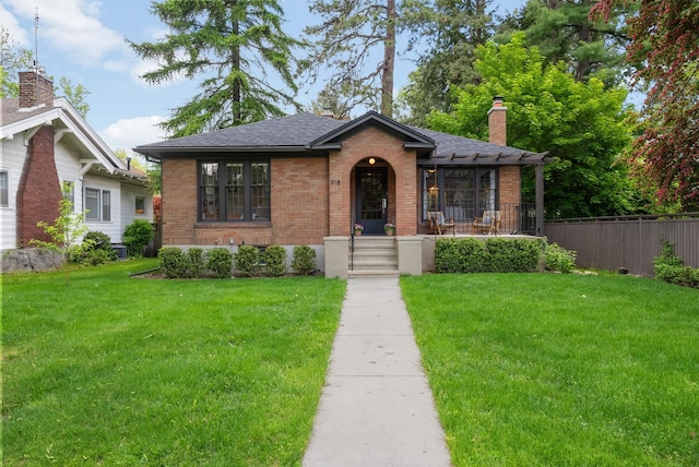 918 W 18th Ave, Spokane, WA 99203 - bungalow-style house featuring brick siding, a chimney, roof with shingles, and covered porch