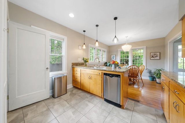 918 W 18th Ave, Spokane, WA 99203 - kitchen featuring a sink, a peninsula, stainless steel dishwasher, and plenty of natural light